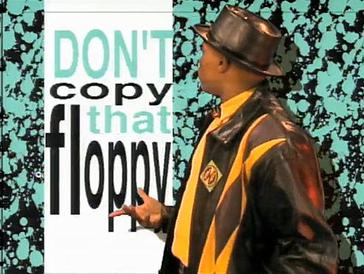 A screenshot of the famous 'Don't copy that floppy' anti-piracy campaign, featuring the rapper standing in front of a background that reads 'Don't copy that floppy'.