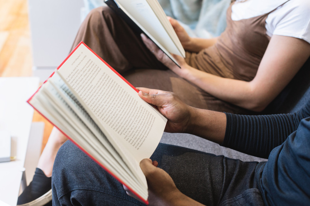 Two people reading books